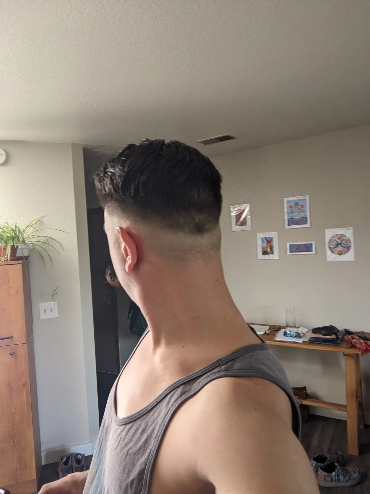 A fresh fade result, neat around the ears and neckline